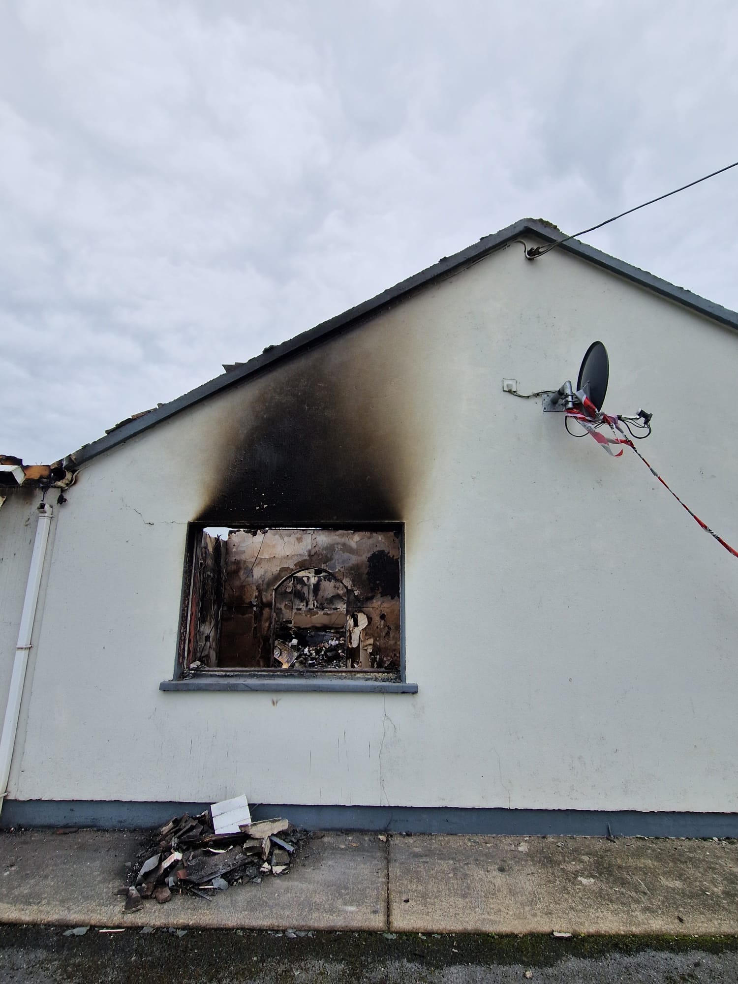 Professional assessment of house fire damage and smoke soot for an insurance claim in Ireland.