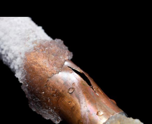Frozen burst pipe in attic causing water damage insurance claim