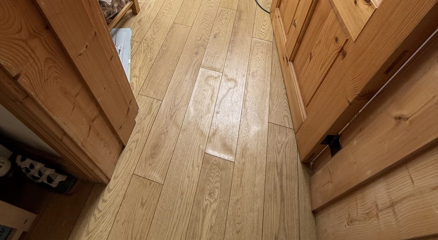 Evidence for a burst pipe claim in an Irish home under timber floor
