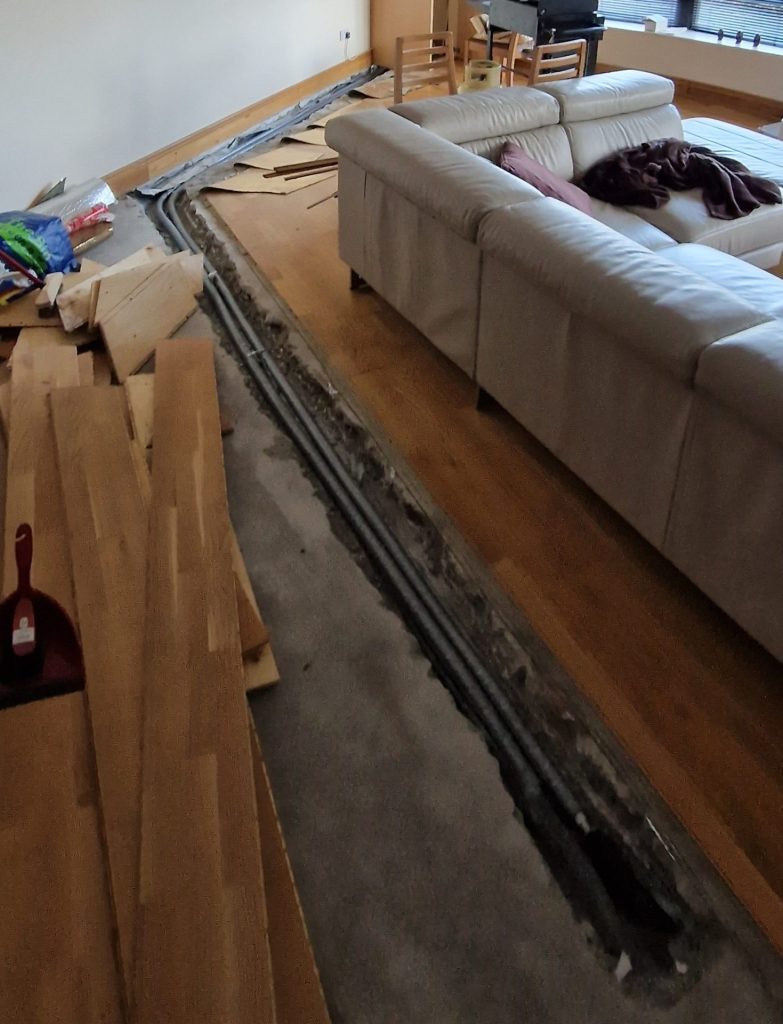Exposed pipework during an underfloor leak insurance claim in Oranmore Galway