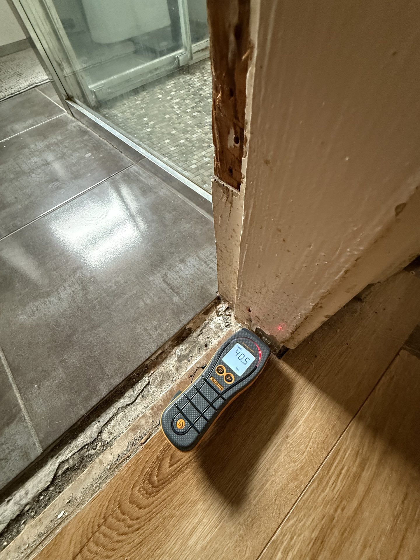 Professional moisture survey by a Galway loss assessor identifying hidden water damage in timber flooring.