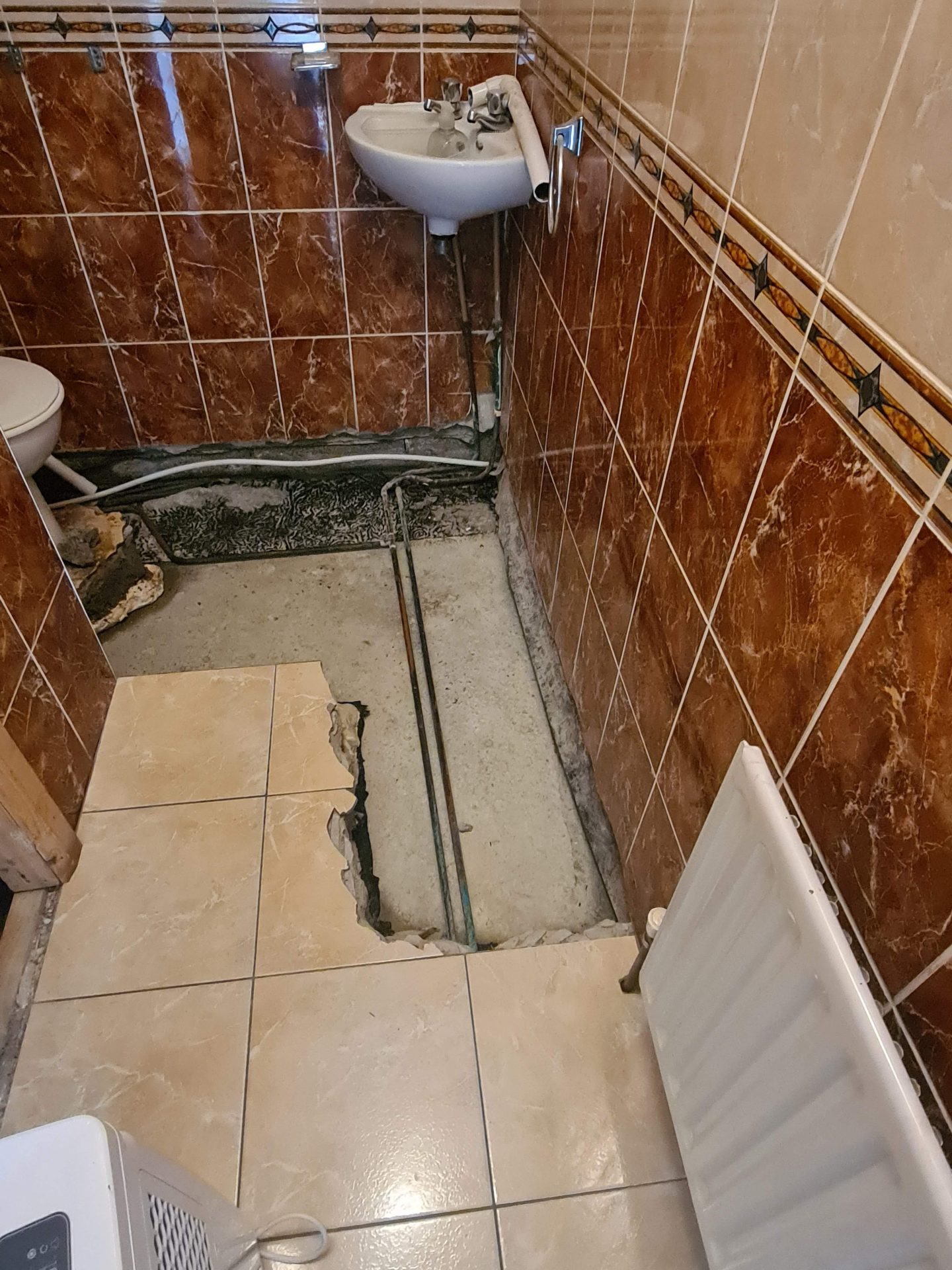Trace and access pipe leak detection in a Galway bathroom managed by Claims Assist loss assessors.