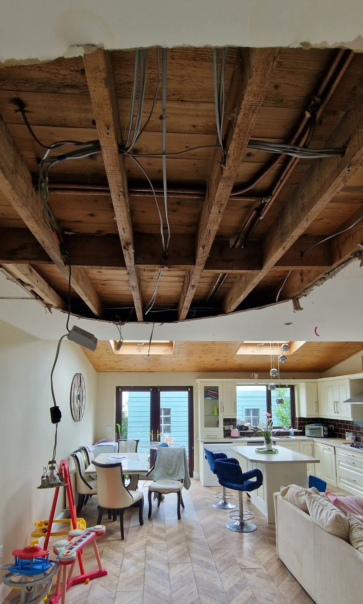 Collapsed kitchen ceiling and water damaged laminate floor from a burst pipe in Lucan, West Dublin. Managed by Claims Assist Loss Assessors.