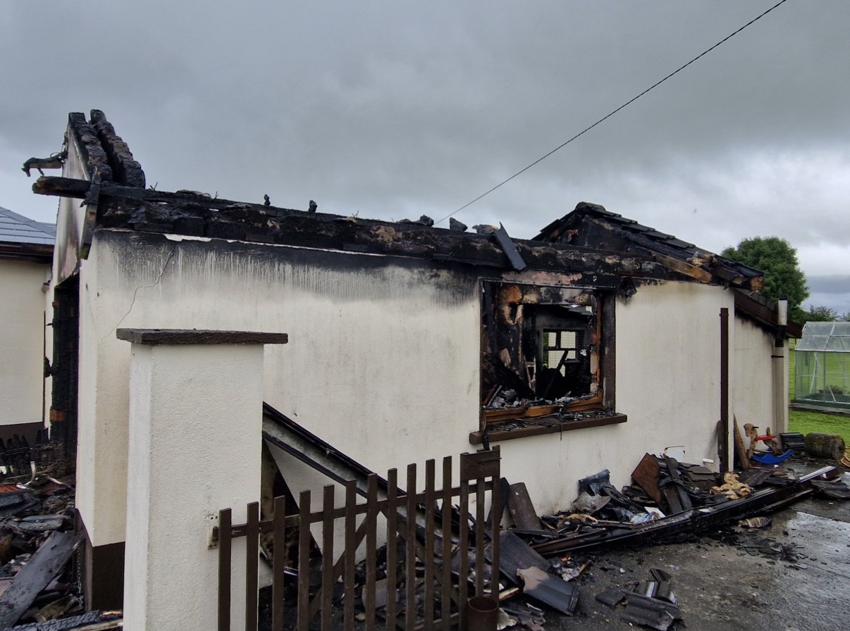 Garage roof destroyed by fire in Clondalkin, Dublin. Expert fire and smoke damage insurance claim management.