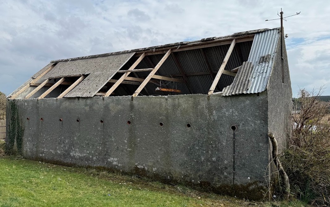 Storm damage to an asbestos shed roof in Lahinch, Clare. Expert insurance claim management for safe asbestos removal and replacement.